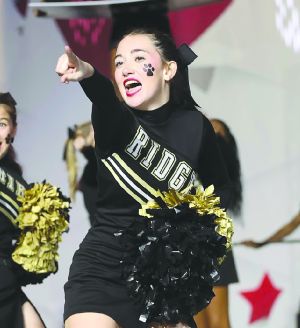 Mullins cheer on granddaughters at State Championship